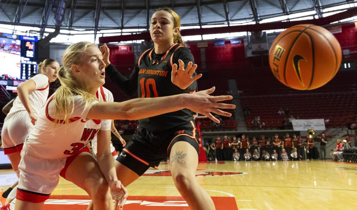 Western Kentucky Lady Toppers guard Josie Gilvin (33)passes the ball during the Lady Topper's game against the Sam Houston Bearkats in Bowling Green, Ky. on Saturday, Jan. 25, 2025.