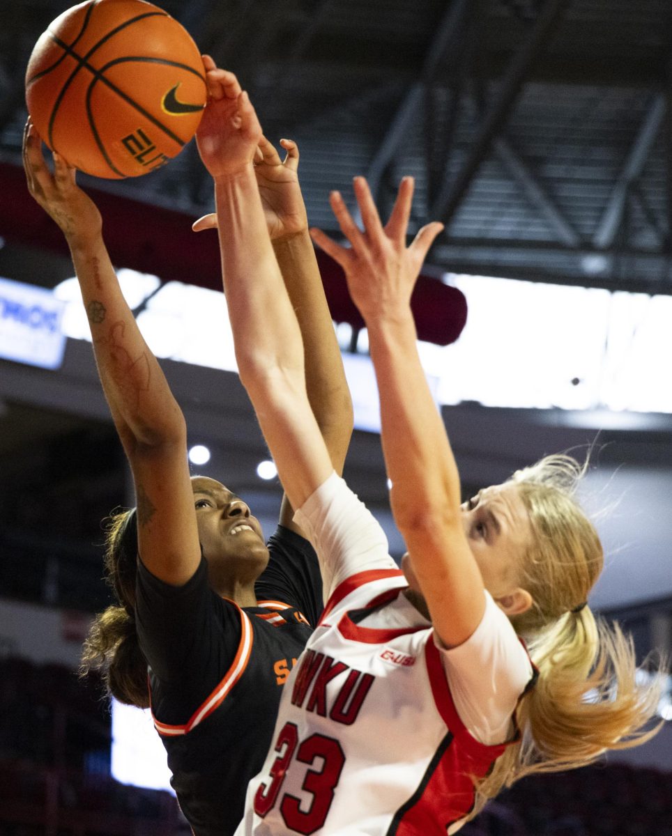 Western Kentucky Lady Toppers guard Josie Gilvin (33) battles for a rebound during the Lady Topper's game against the Sam Houston Bearkats in Bowling Green, Ky. on Saturday, Jan. 25, 2025.