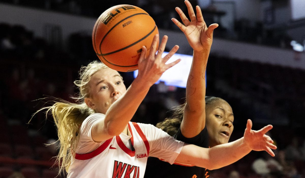 Western Kentucky Lady Toppers guard Josie Gilvin (33) clashes with a defender during the Lady Topper's game against the Sam Houston Bearkats in Bowling Green, Ky. on Saturday, Jan. 25, 2025.