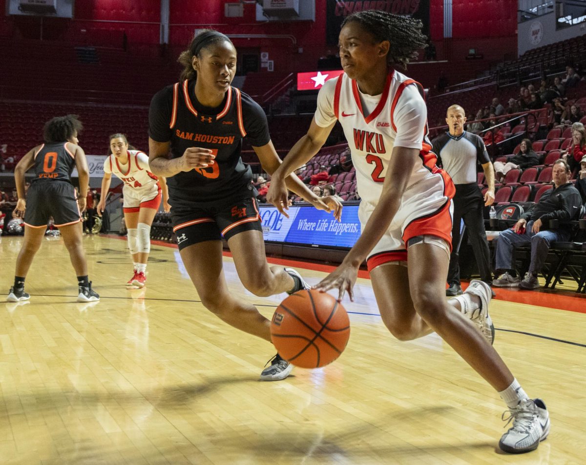 Western Kentucky Lady Toppers forward Torri James (2) drives the ball in the paint during the Lady Topper's game against the Sam Houston Bearkats in Bowling Green, Ky. on Saturday, Jan. 25, 2025.