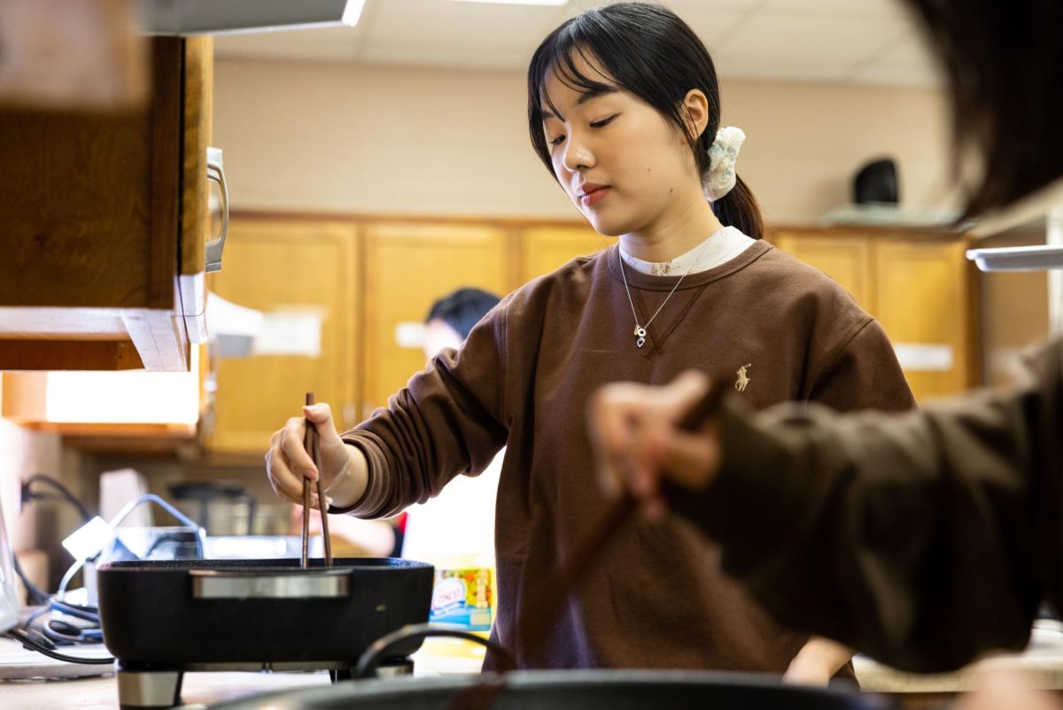 Chinese Flagship Program teaching assistant Yin Cong Zheng fries dumplings to celebrate the Lunar New Year, the Year of the Snake, in the Academic Complex on Wednesday, Jan. 29, 2025. 