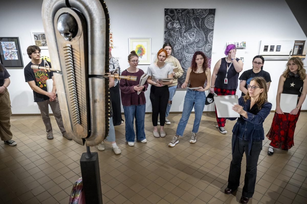 Professor Yvonne Petkus’s demonstrates how to sketch to her Level II Painting Practices class before assigning them to sketch art during WKU’s Art & Design Alumni Exhibition in the University Gallery room in FAC on Feb. 3, 2025. 