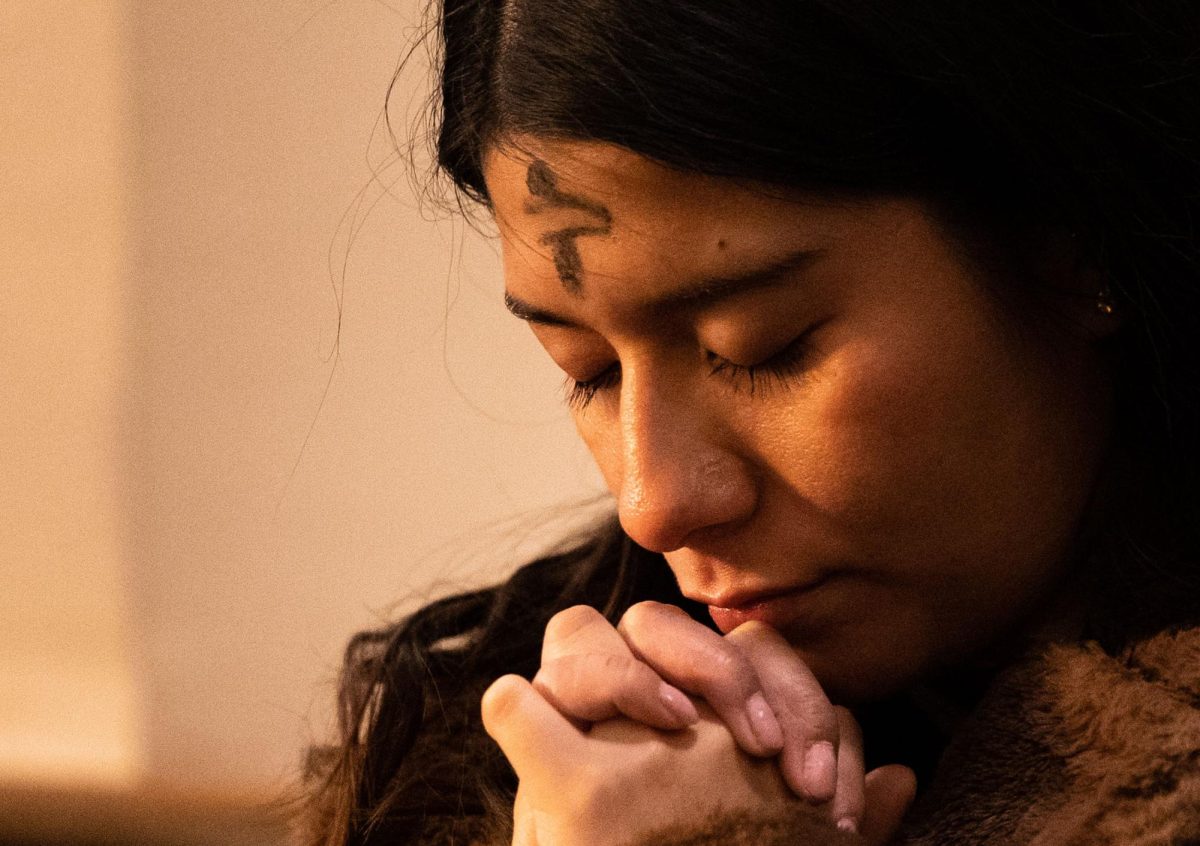 Casey Gomez, a South Central Kentucky Community and Technical College student, prays after receiving communion during Ash Wednesday mass at St. Joseph’s Catholic Church in Bowling Green on Wednesday, March 5, 2025.