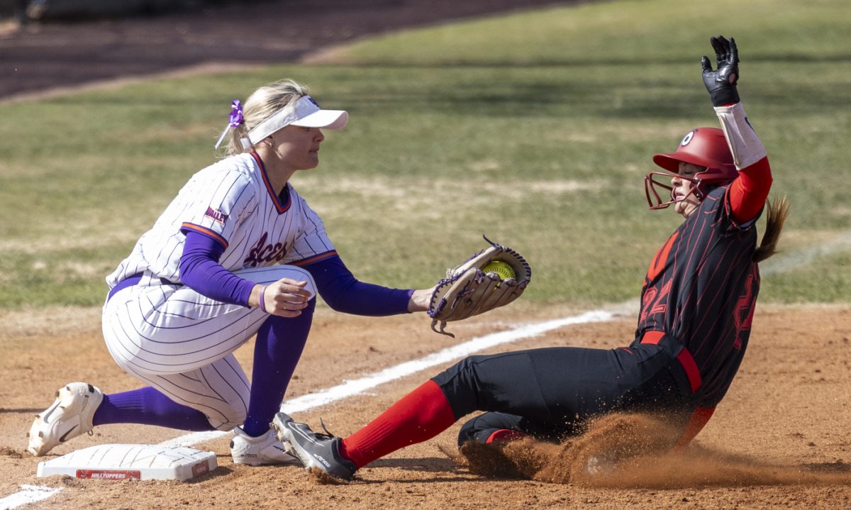 Western Kentucky University left fielder Kennedy Stinson (22) slides safely into third base during a game against the University of Evansville at the WKU Softball Complex on Saturday, March 1, 2025.