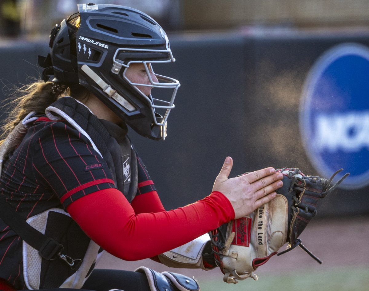 Western Kentucky University catcher Randi Drinnon (7) hits her glove before receiving the ball during a game against the University of Kentucky at the WKU Softball Complex on Saturday, March 1, 2025.