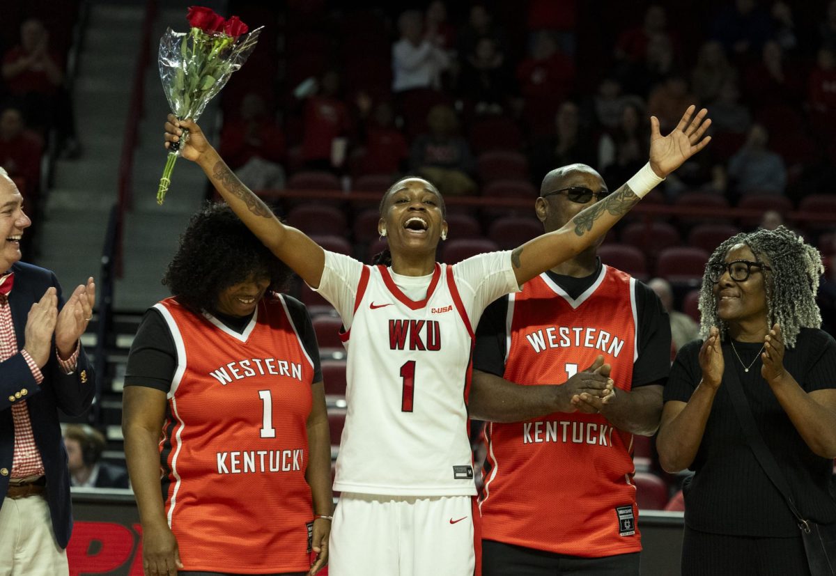 Western Kentucky Lady Toppers guard Destiny Salary (1) opens her arms in gratitude to the fans during the senior day recognition following the Lady Toppers basketball game vs. the New Mexico State University Aggies at E.A. Diddle Arena on March, 1, 2025. WKU won 85-68.