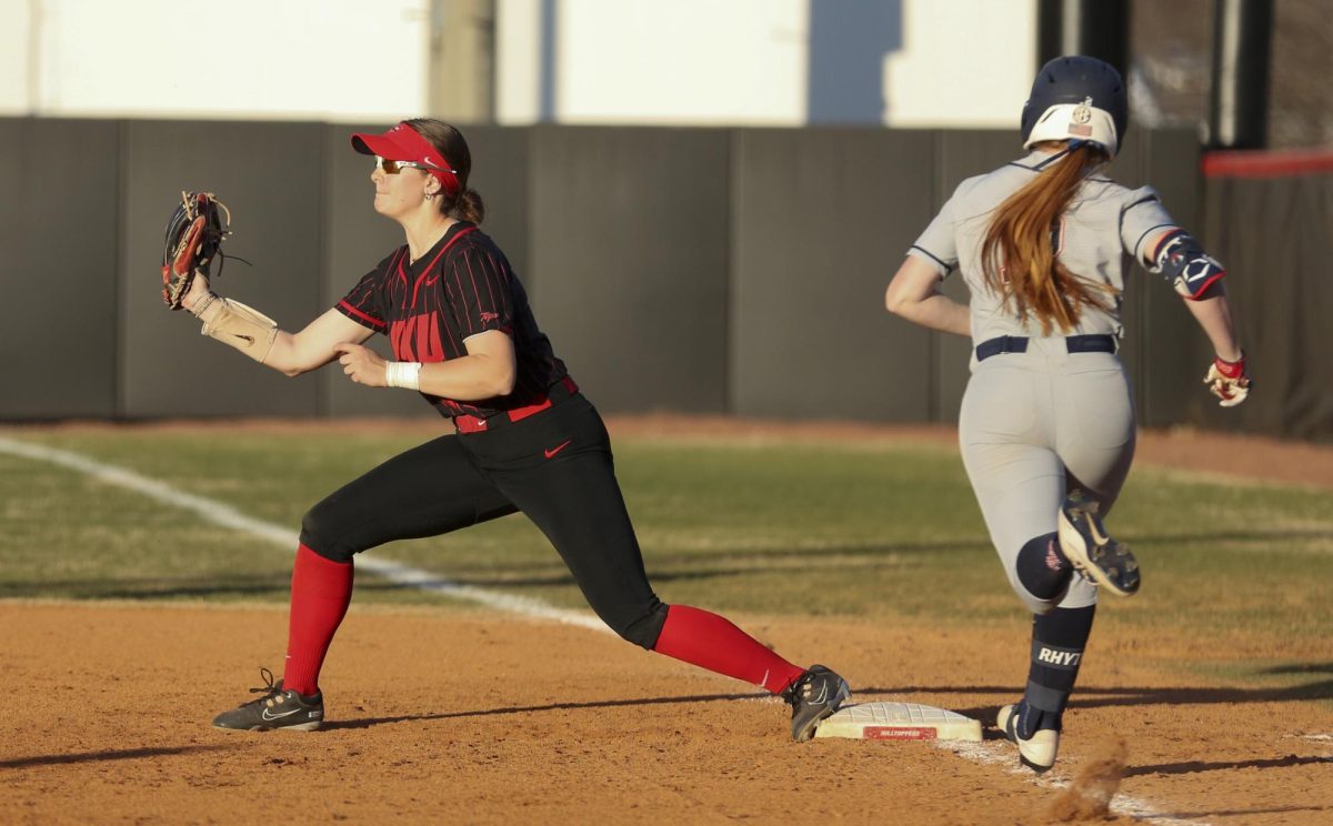 Western Kentucky University sophomore, Annie White (16) prepares to Cath the ball at first base as Ole Miss senior, Angeline DeLeon (26) attempts to reach the bag safely on March 11, 2025.