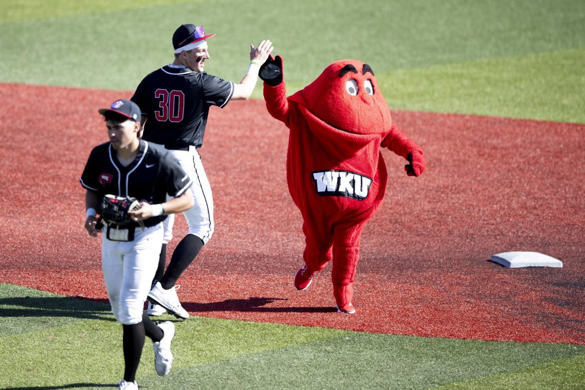 WKU’s Big Red high fives center infielder Kyle Hayes (30) after WKU’s victory against the UNC Asheville Bulldogs 3-0 on Sunday, March 9, 2025 at Nick Denes Field.