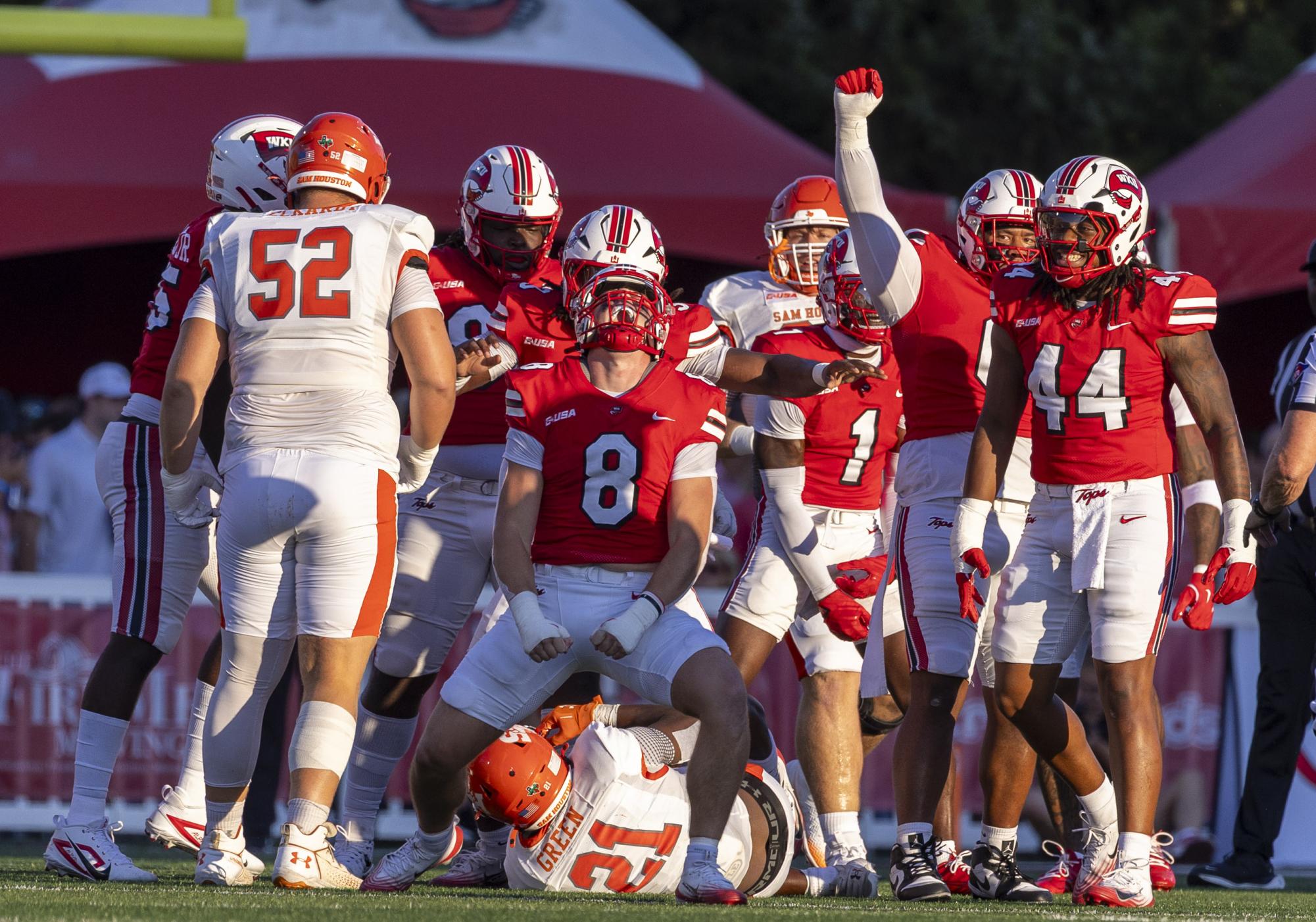 WKU linebacker Miller Malone (8) stops Sam Houston running back Elijah Green (21) from scoring a touchdown during the WKU home opener against Sam Houston in Houchens-Smith Stadium on Saturday, Aug. 23, 2025.