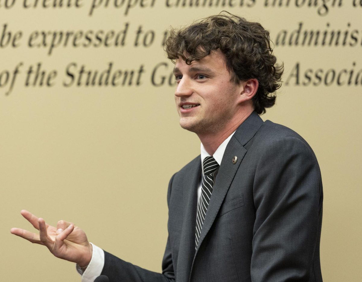 SGA President Rush Robinson gives his report during the SGA meeting on Tuesday, Aug. 26, 2025, in the Senate Chambers of the Downing Student Union building at Western Kentucky University.