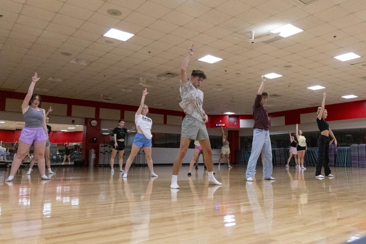 Attendees of the weekly dance fundamentals class perform a dance move during the weekly dance fundamentals class at the WKU Preston Center on Sept. 24, 2025. The theme for the week’s class was “Hamilton.”