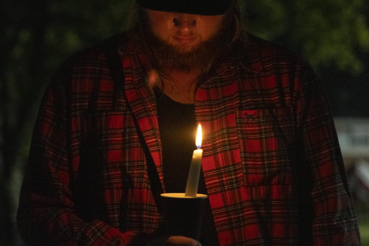 James Fevold bows his head and closes his eyes in prayer during the WKU chapter of Turning Point USA’s vigil for conservative commentator Charlie Kirk on the South Lawn on Thursday, Sept. 25, 2025.
