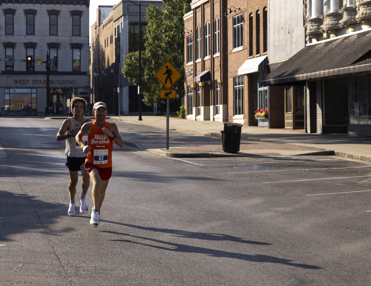 Two runners run in Bowling Green’s downtown square on Saturday, Sept. 20, 2025, during the Med Center Health 10k Classic in Bowling Green, Ky.
