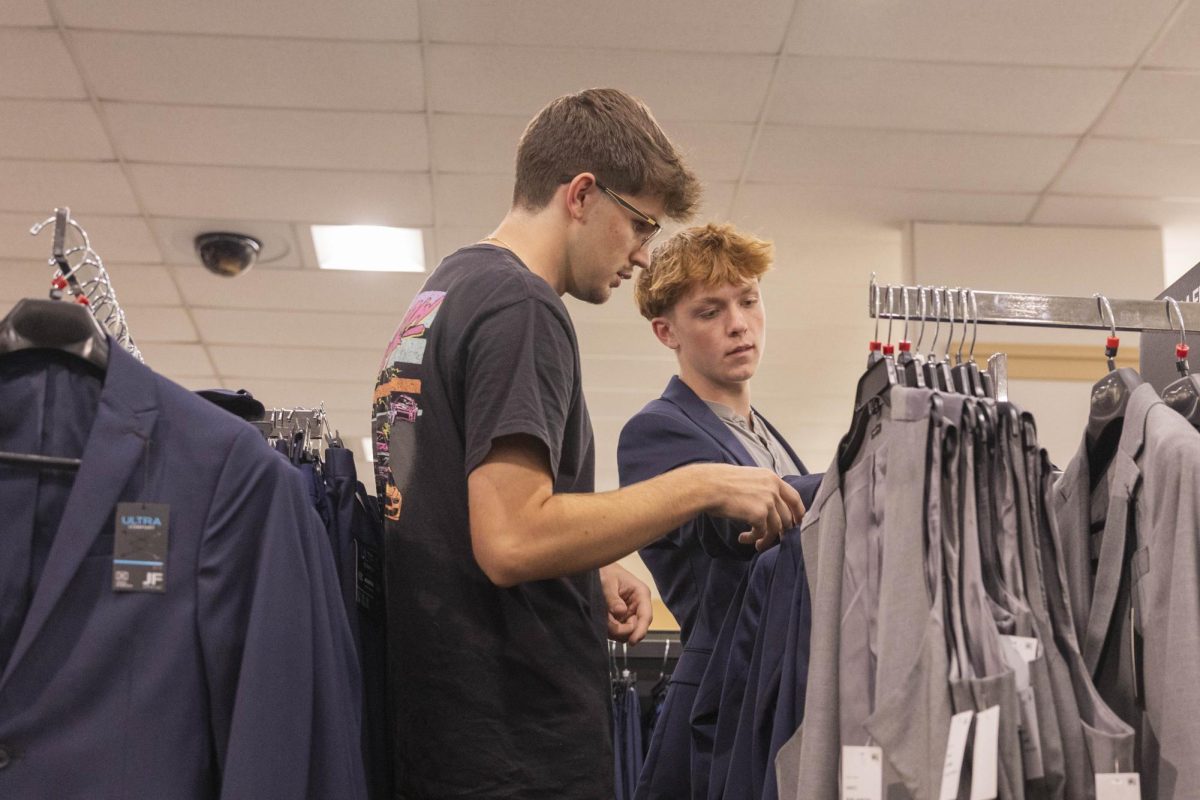 Freshman Business Supply Chain Management Major Caleb Key and Freshman Business Management Major Owen Lunsford browse through dress clothes at the JCPenney “Suit-Up” event in Greenwood Mall on Tuesday, Sept. 16, 2025. 
