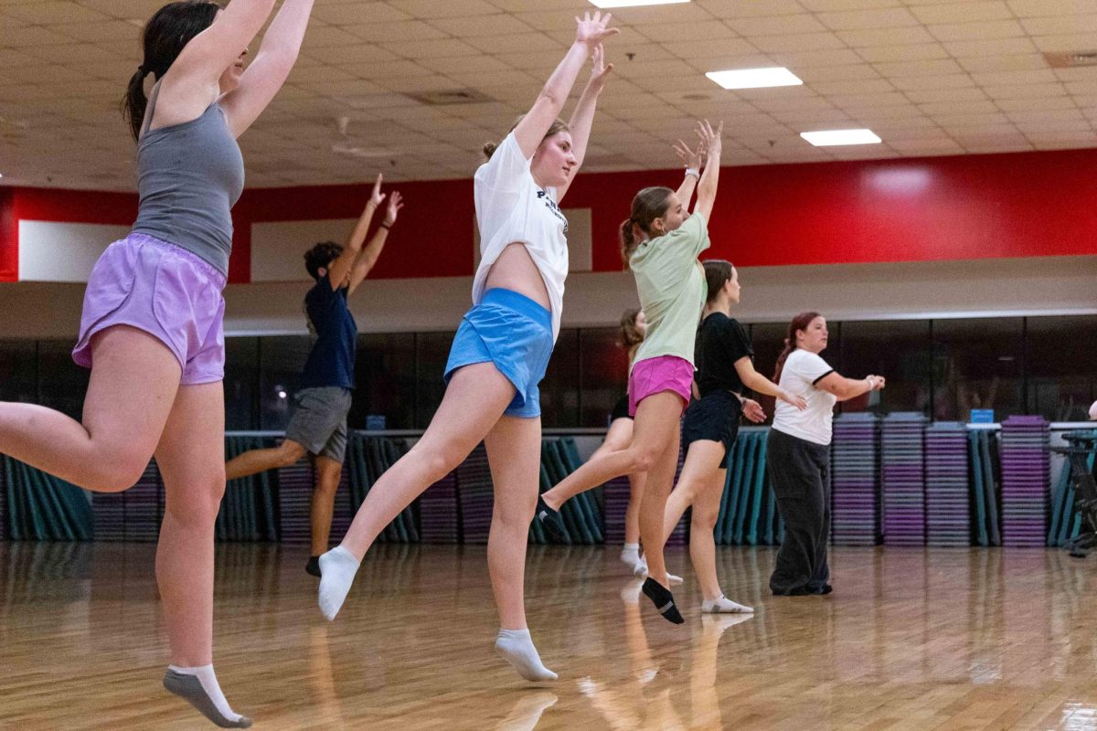 Freshman musical theater and elementary education double major Annie Pilbean performs a dance move during the weekly dance fundamentals class at the WKU Preston Center on Sept. 24, 2025. The theme for the week’s class was “Hamilton.”