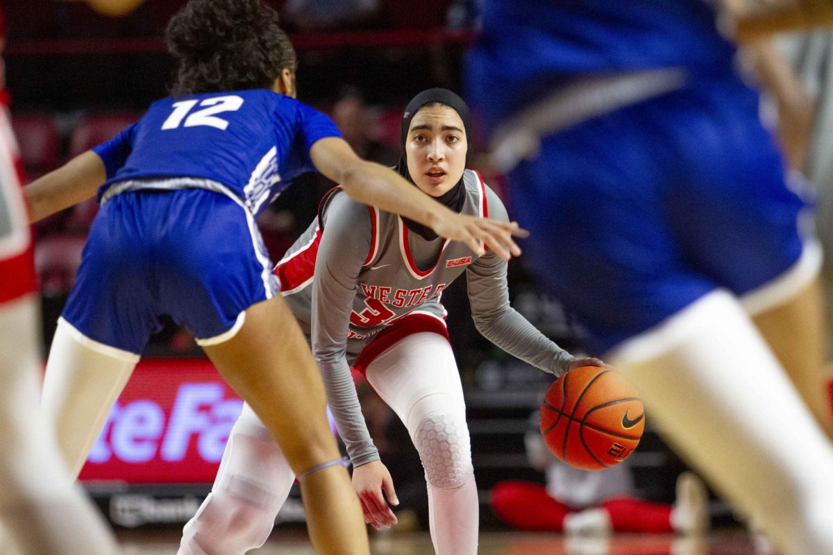 Western Kentucky University Guard Salma Khedr (34) dribbles the ball as Indiana State Guard Kayla Smith (12) attempts to block on Friday, Nov. 14 2025 during the basketball game against Indiana State in E.A. Diddle Arena in Bowling Green, Ky.