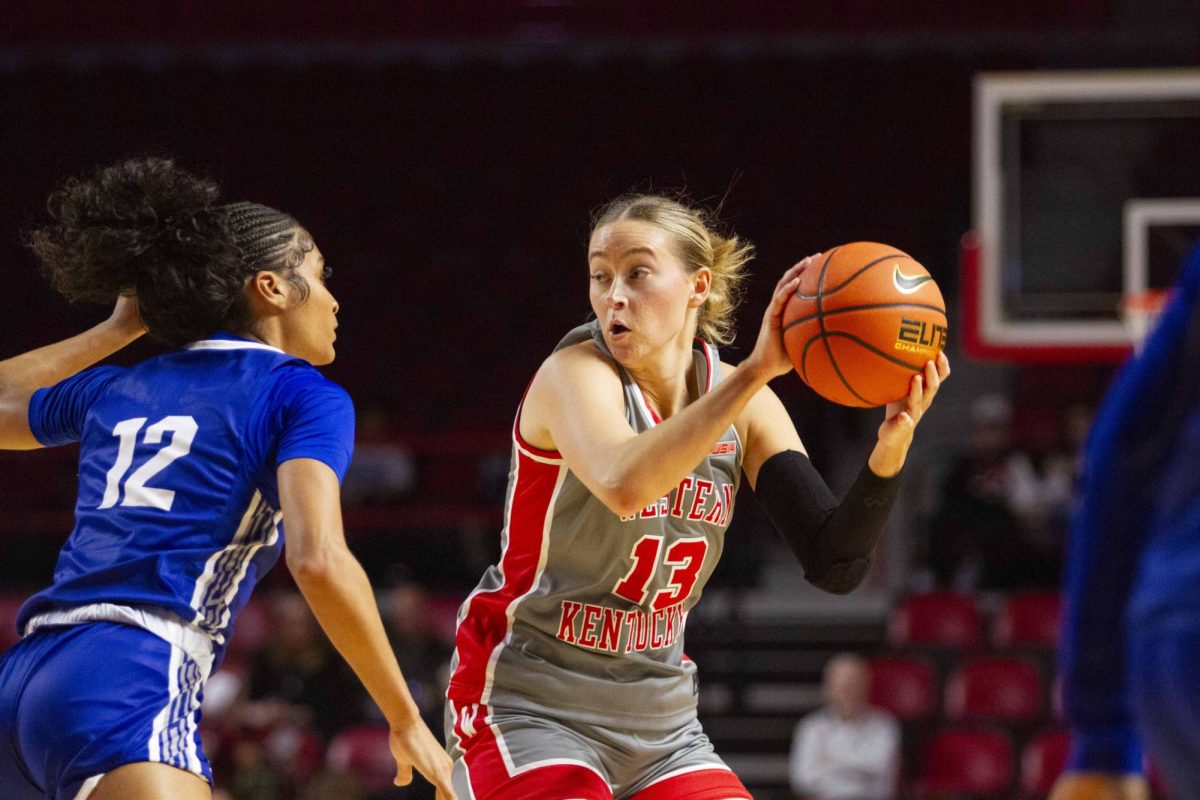 Western Kentucky University Forward Tatum Boettjer (13) tries to pass the ball as Indiana State Guard Kayla Smith tries to block on Friday, Nov. 14 2025 during WKU’s basketball game against Indiana State in E.A. Diddle Arena in Bowling Green, Ky.