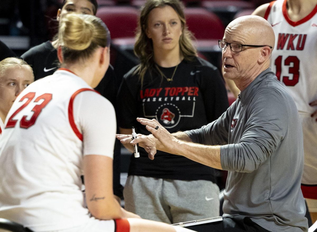 Western Kentucky University’s women’s basketball Head Coach Greg Collins discusses plays in a timeout during WKU’s game against Vanderbilt University on Nov. 19, 2025. 