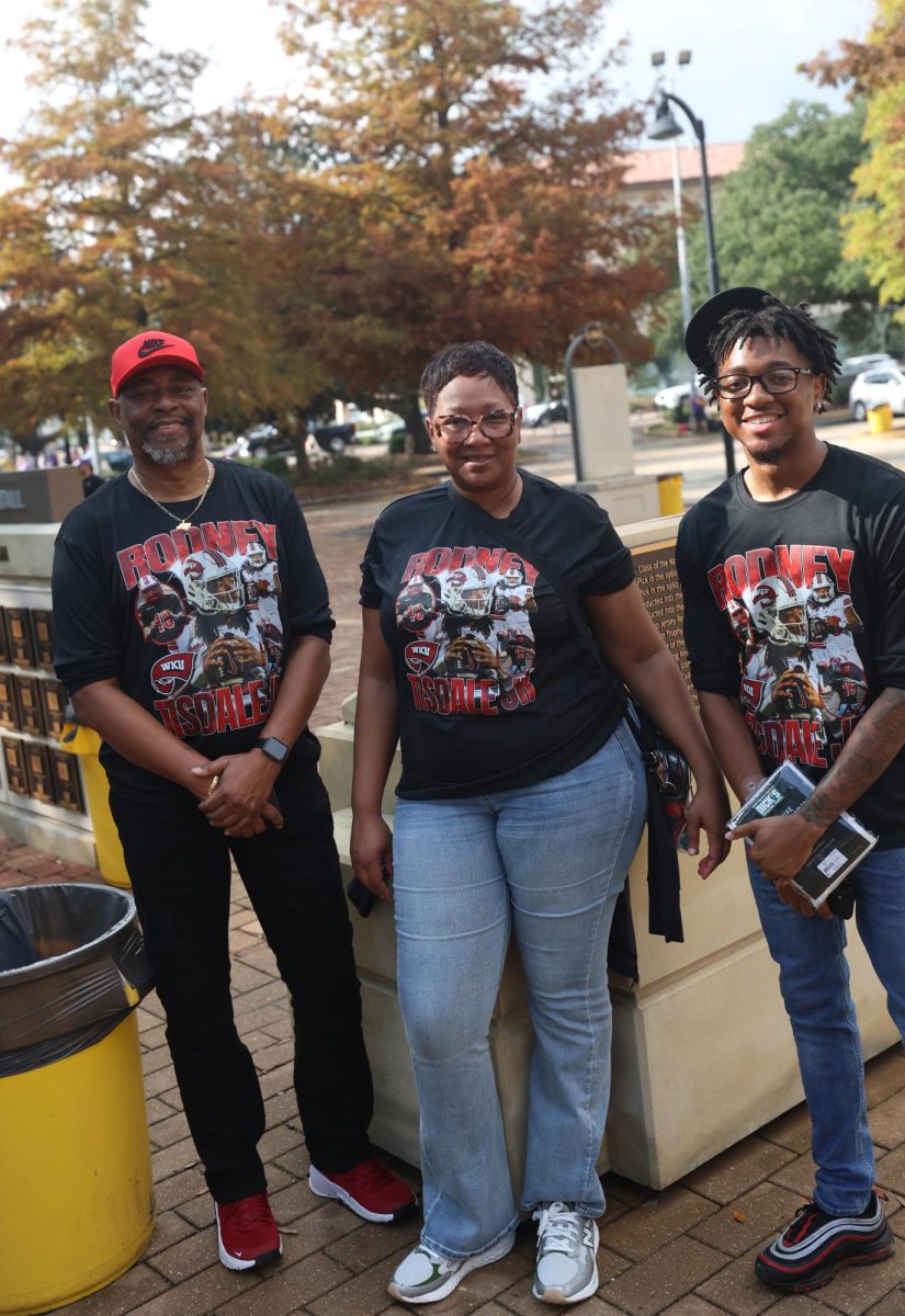 Anthony Brown, Kenya Tisdale and Jaylen Houston, family of WKU quarterback Rodney Tisdale Jr., in front of Tiger Stadium in Baton Rouge. La, on Saturday, Nov. 22, 2025.
