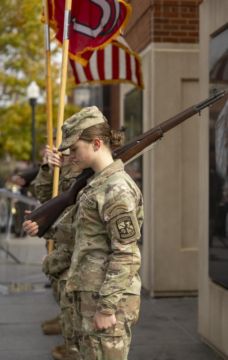 MS III Cadet Kaelyn M. Usenuku bows her head during a moment of silence while serving as a rifle guard in the Color Guard at WKU’s Veterans Day ceremony on Tuesday, Nov. 11, 2025.
