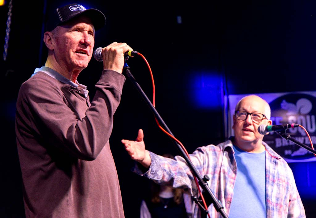 Ernie Smalls (right) and Alan Simpson welcome concert attendees to Pints for Public Media on Saturday, Nov. 22, 2025 at White Squirrel Brewery. Throughout the night Smalls and Simpson urged the audience to donate to WKU Public Media. “ No donation is too large or too small,” Smalls said.