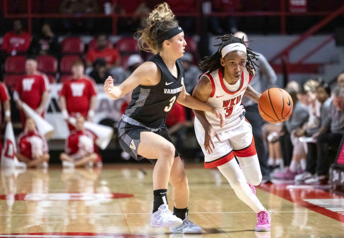 Western Kentucky University forward Tia Shelling (3) drives past Vanderbilt University guard Aubrey Galvin (3) during WKU’s game against the Vanderbilt University Commodores in Diddle Arena on Wednesday, Nov. 19, 2025.