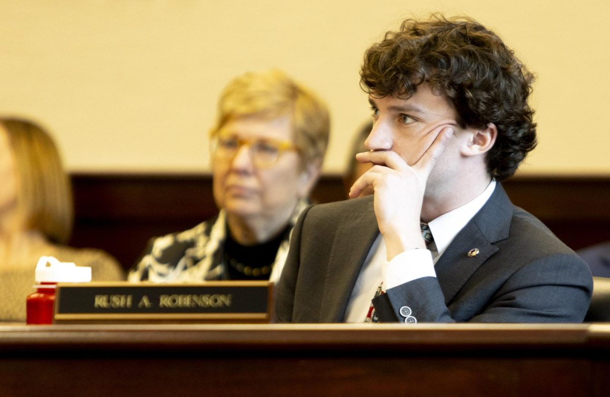 Student Government Association President Rush Robinson listens as Julian Sagastume of the consulting firm Brailsford & Dunlavey answers his question regarding student’s quality assurance in privately-owned dorms during the final Board of Regents meeting of the fall semester in the Cornelius A. Martin Regents Room in Jody Richards Hall on Thursday, Dec. 11, 2025. Under the agreement, student focus groups would be surveyed on quality of life and Gilbane would be responsible for maintenance and repair of residence halls. 