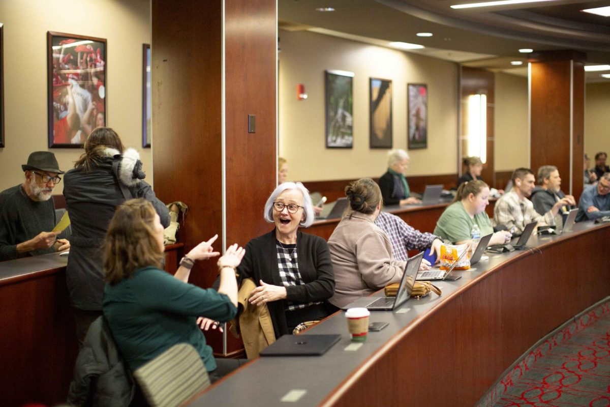 Western Kentucky University faculty and staff chat before the opening of the first Faculty Senate meeting of the semester in the Downing Student Union Senate Chambers on Thursday, Jan. 22, 2026. 