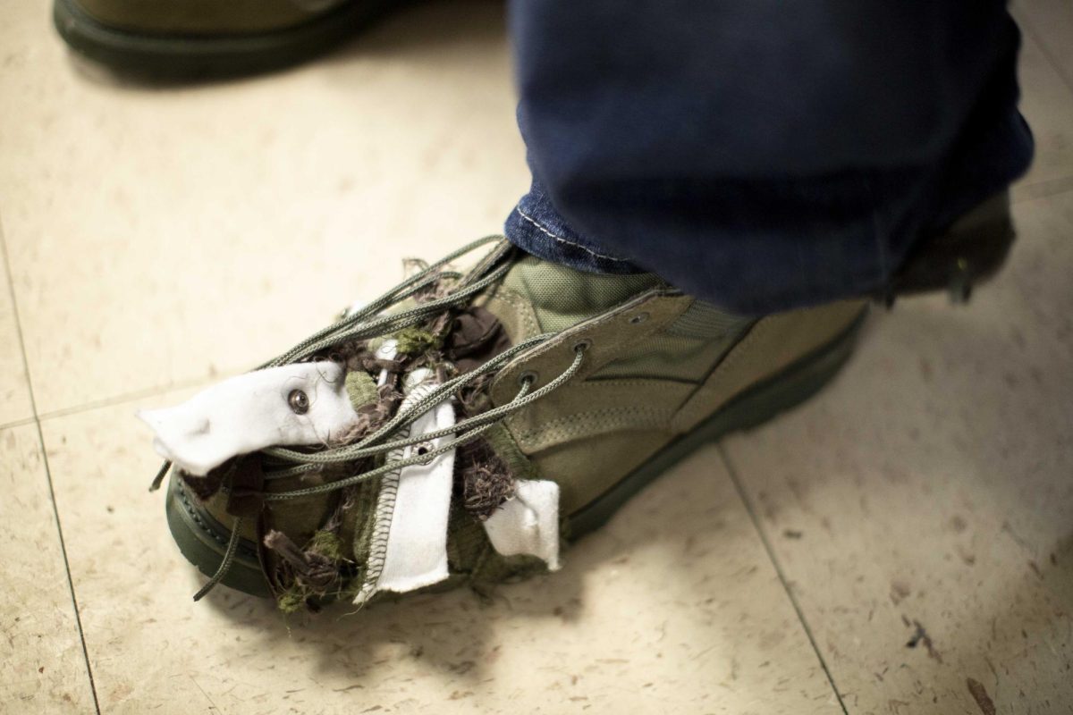 William Allen’s shoe is held together with string bits of fabric inside the Salvation Army’s warming center on W. Main Ave in Bowling Green, Ky. on Saturday, Jan. 24, 2026 during intense winter weather. Mary Osbourne, a long-time volunteer at the shelter, said that walking shoes are a frequent need for incoming unhoused people. 