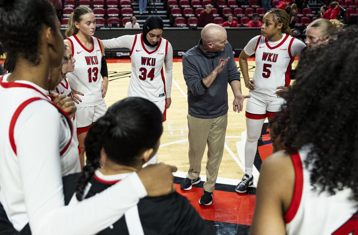 Western Kentucky University head coach Greg Collins speaks to his team after losing the basketball game against the New Mexico State Aggies on Thursday, Jan. 8, 2026, in E.A. Diddle Arena in Bowling Green, Ky.