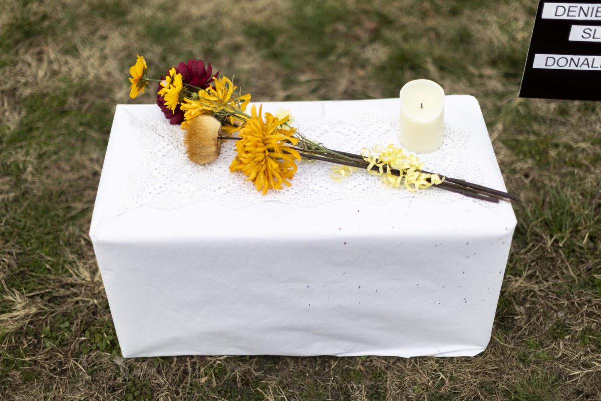 Protestors laid flowers on a small table outside the regional Department of Homeland Security office during SOKY Indivisible’s protest in Bowling Green, Ky. on Thursday, Jan. 8, 2026 following the killing of Renee Nicole Good by ICE agents in Minneapolis, Mn.