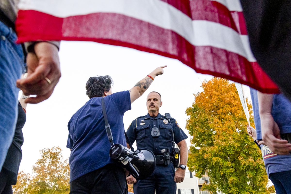 Congressional candidate Megan Wingfield speaks with Captain Mike Elliott of the BGPD after ICE agents called to have protestors removed from the building’s parking lot on Wednesday, Nov. 5, 2025, during a protest of the recent arrest of Ismael Cruz Sanchez.