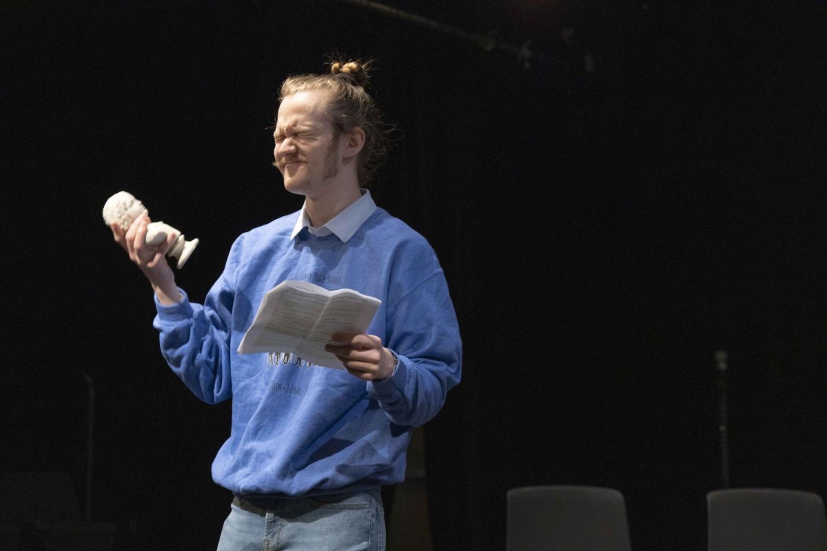 Freshman Theatre major Emory Heckman cringes at a figure that his ex girlfriend left behind during Plays in a Day produced by the WKU Student Chapter of Alpha Psi Omega at the Lab Theatre in Gordon Wilson Hall Sunday, Feb. 8, 2026. 