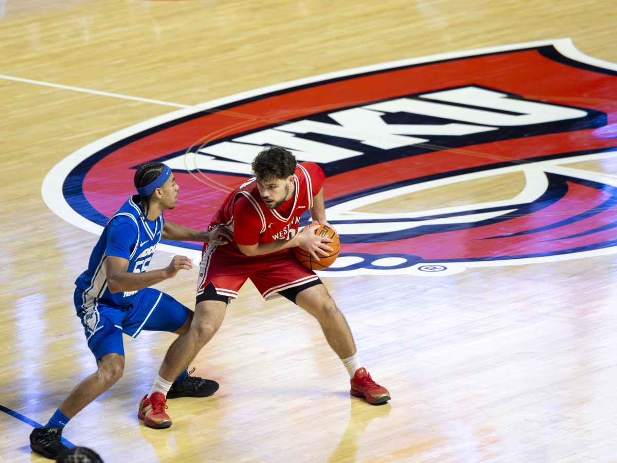 Western Kentucky University Hilltoppers guard Teagan Moore (30) guarded the ball from Middle Tennessee State University’s guard Sean Smith (55) on Saturday, Feb. 14, 2026. 