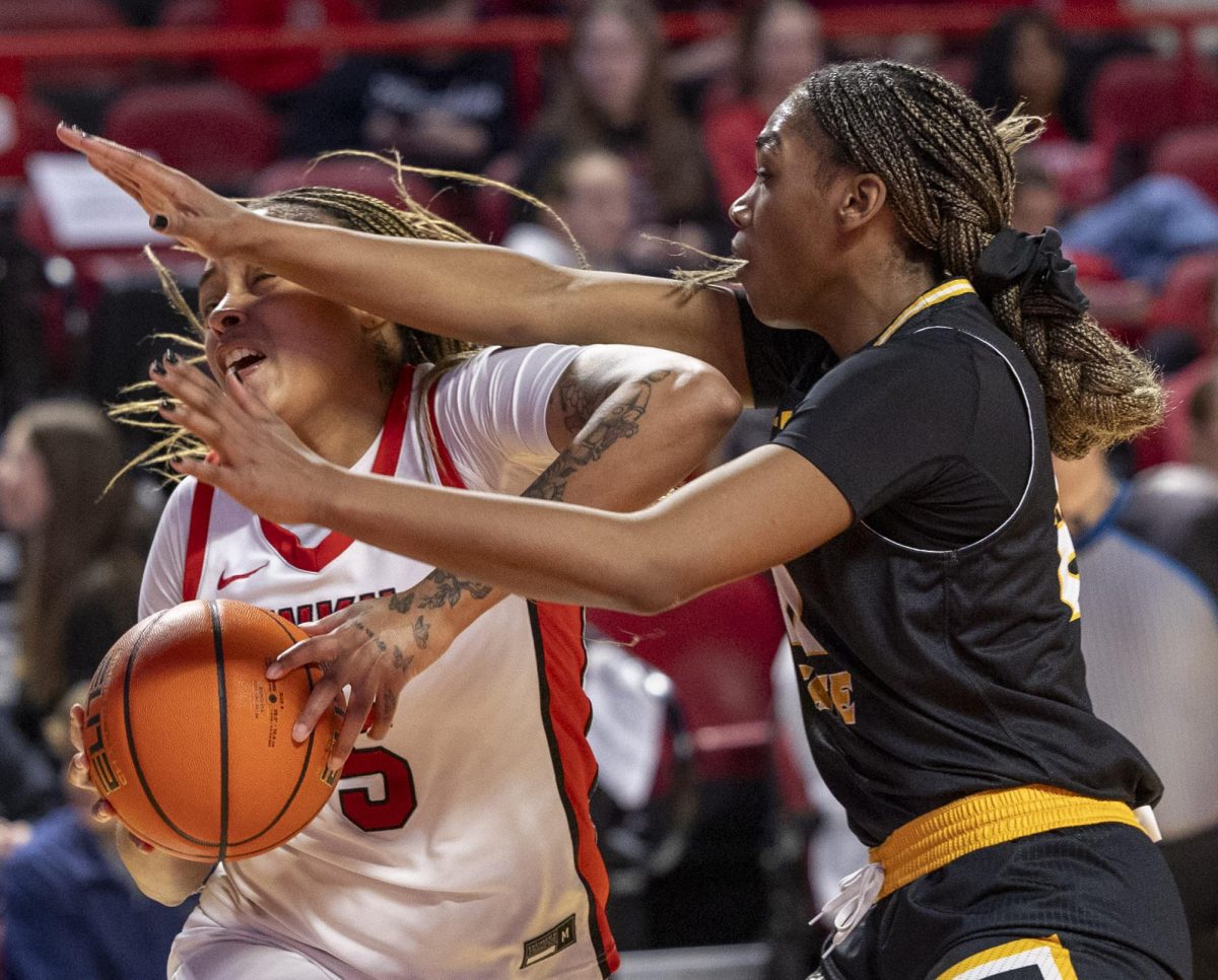 Western Kentucky University forward Mya Pratcher (5) gets blocked by Kennesaw State Forward  Latazia Williamson (22) on Thursday, Feb. 12, 2026 during the basketball game against Kennesaw State in E.A. Diddle Arena in Bowling Green, Ky.