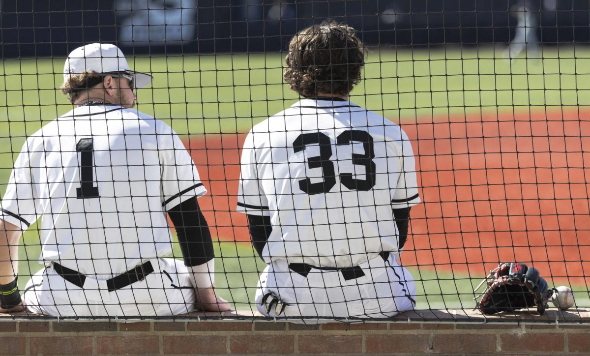 Western infielder Dalton Fiveash (1) and catcher Daniel Stewart (33) talk on the sideline before Western’s first game against Brigham Young University on Friday, Feb. 13, 2026 at Nick Denes Field. Stewart was at bat five times during the game. BYU won 3-2.