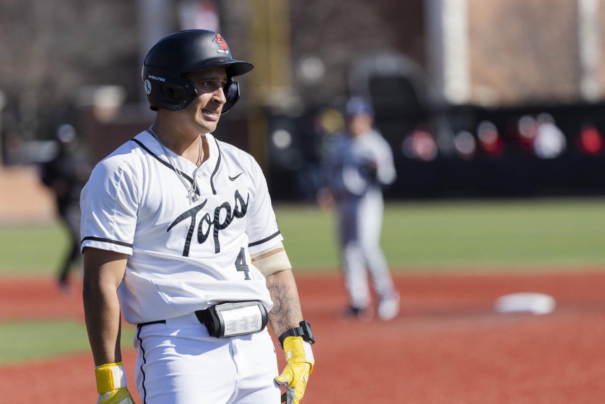 Western infielder JP Acosta (4) looks to the distance after reaching first base during Western’s game against Brigham Young University on Friday, Feb. 13, 2026 at Nick Denes Field. The play was reviewed and Acosta was declared not safe. Acosta finished the game with one hit, one run batted in, one sacrificial hit, and one walk.