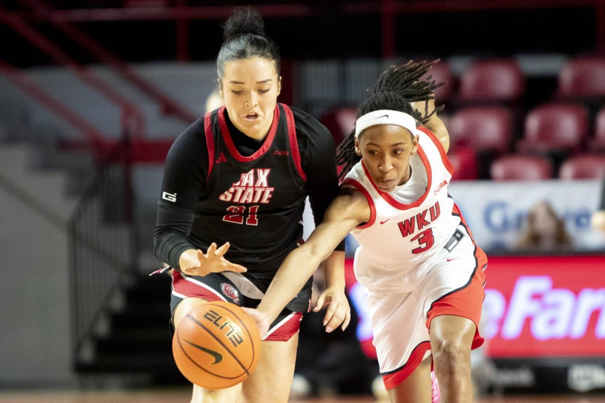 Western Kentucky University guard Tia Shelling (3) steals the ball from Jacksonville State’s Kyera Thornsbury (21) during WKU’s Valentine’s Day game against Jacksonville State in E.A. Diddle Arena on Saturday, Feb. 14, 2026. WKU trailed by one point at the half as the Lady Toppers attempt to end an eight game losing streak. 
