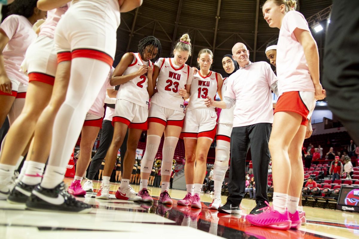 Western Kentucky University head coach Greg Collins gathers with the Lady Toppers center court after WKU’s Valentine’s Day win against Jacksonville State in E.A. Diddle Arena on Saturday, Feb. 14, 2026. The Hilltoppers broke an eight game losing streak after trailing Jax State for the majority of the first half. The Hilltoppers won 56-41. 
