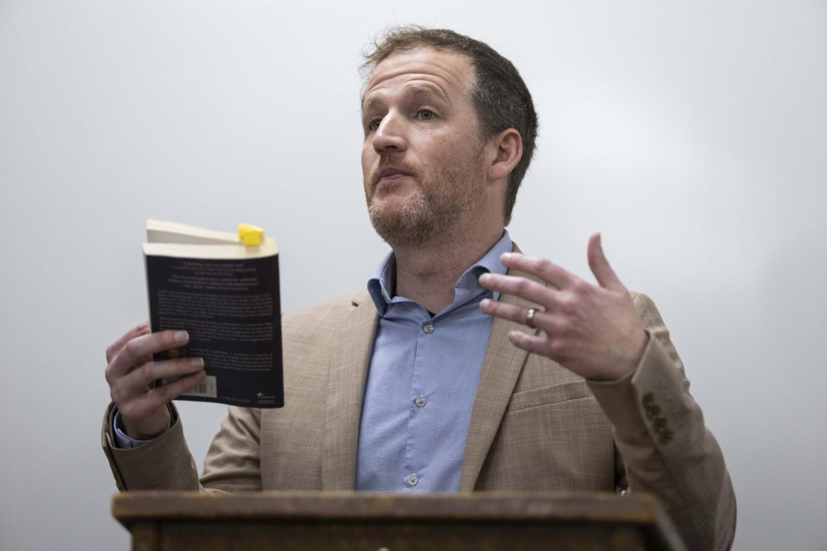 Novelist Nathan Gower explains that reoccurring themes of mental health and illness in his novel were inspired by his familial history during the public reading of “The Act of Disappearing” by Nathan Gower in Grise Hall on Wednesday, Feb. 18, 2026. 