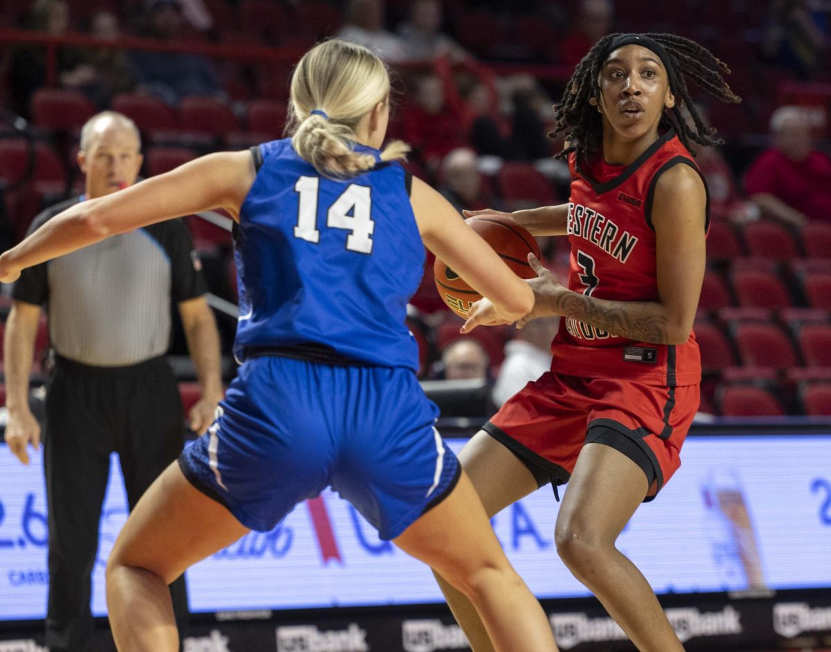 Western Kentucky University’s guard Tia Shelling (3) guards the ball from Middle Tennessee State University guard Savannah Davis (14) during WKU’s game against MTSU in E.A. Diddle arena on Saturday, Feb. 21, 2026. 