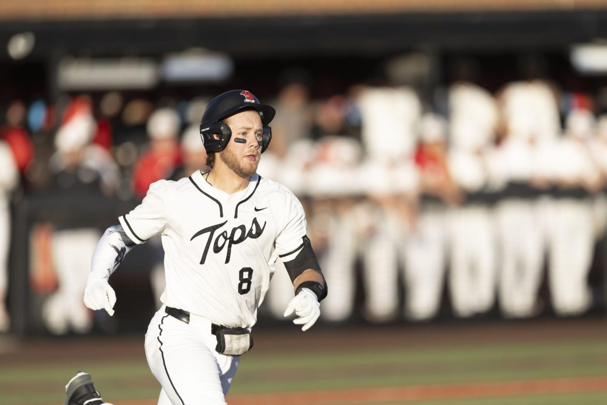 Western Kentucky University catcher Camden Ross (8) jets to first base after a hit during Western’s game against Indiana University on Friday, Feb. 27, 2026 at Nick Denes Field. Ross finished the game with three hits, two runs batted in, one run, and a whopping 10 put outs.