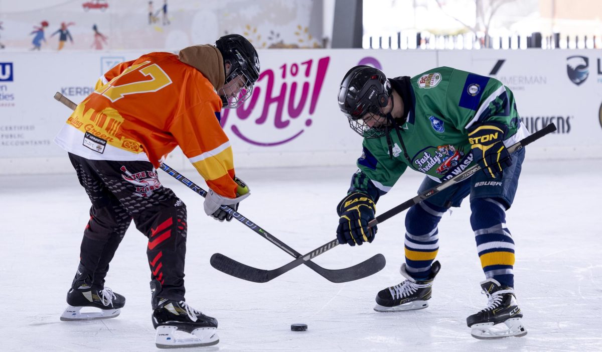 Team Fast Freddys and Team Magna face-off before the start of their game on Friday, Jan. 30, 2026 during the third annual BG Puck Classic.
