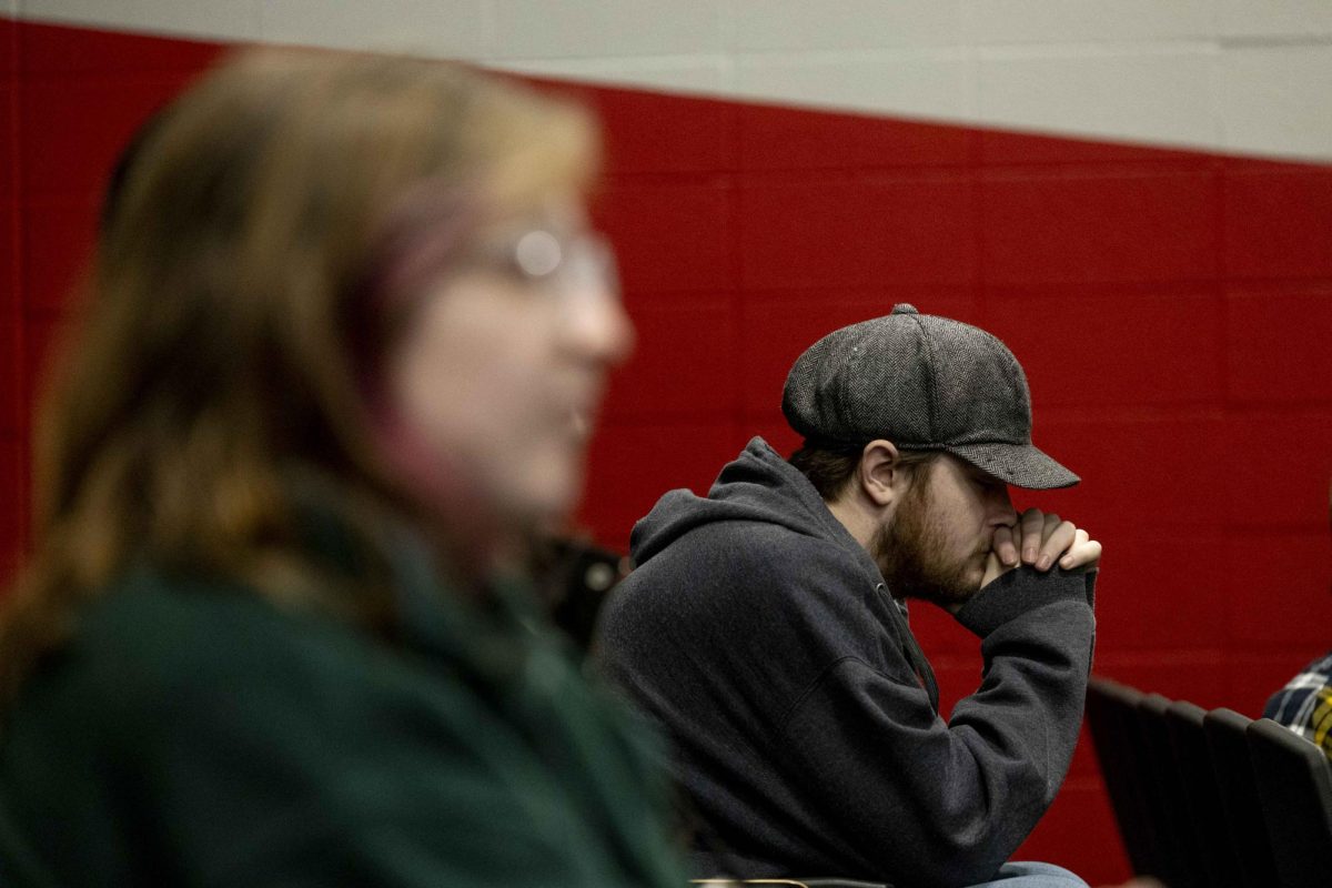 Western Kentucky University first year graduate student RJ Pugh listened to a poem read by WKU junior Andrew Dover at the Department of English’s Open Mic Night on Thursday, Feb. 26, 2026 in Grise Hall.