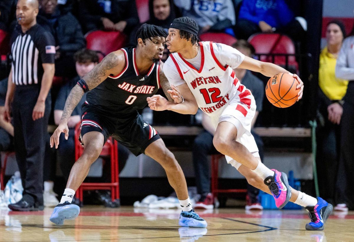 Western Kentucky University Hilltoppers Guard Armelo Boone (12) pushes against Jacksonville State’s Guard AC Bryant (0) during WKU’s game against the Jacksonville State Gamecocks in E.A. Diddle Arena on Thursday February 5, 2026. 