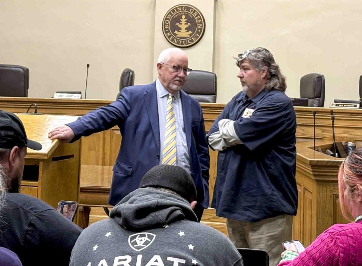Fountain Square Towing owner Slim Nash and his attorney Alan Simpson speak while the Board of Commissioners holds a closed session on Feb. 17, 2026 in Bowling Green City Hall. 