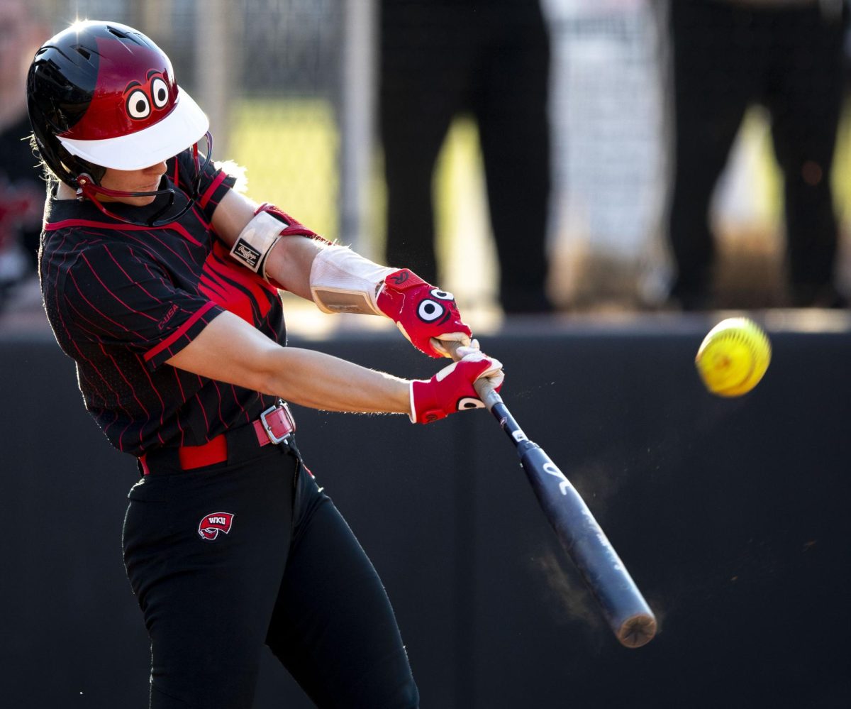 Western Kentucky University outfielder Kendle White (21) connects for a home run to the left fence during WKU’s home game against Ball State on Saturday, Feb. 28, 2026.