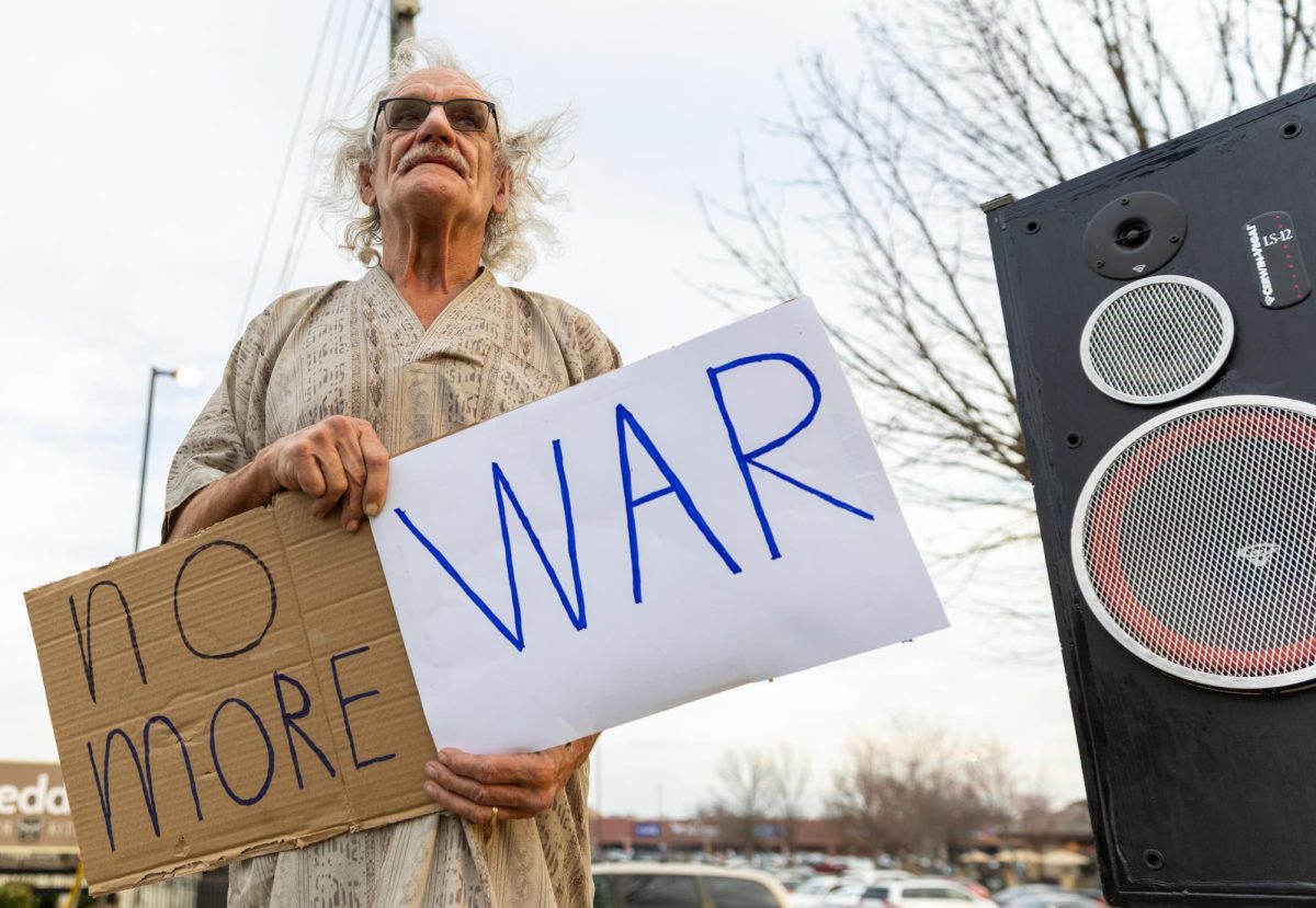 Tim Decker, who played music at the SOKY Invisible “No War in Iran” protest at the four corners of Nashville Road and Campbell Lane in Bowling Green, Kentucky, Wednesday, March 4, 2026.
