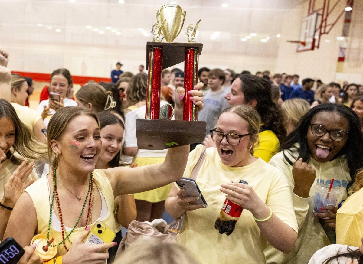 Sophomore Abigail Wissing The spirt chair of Alpha Gamma Delta cheers with fellow AGD members after winning the trophy for most money earned during Dance Big Red on Saturday, March 7, 2026.