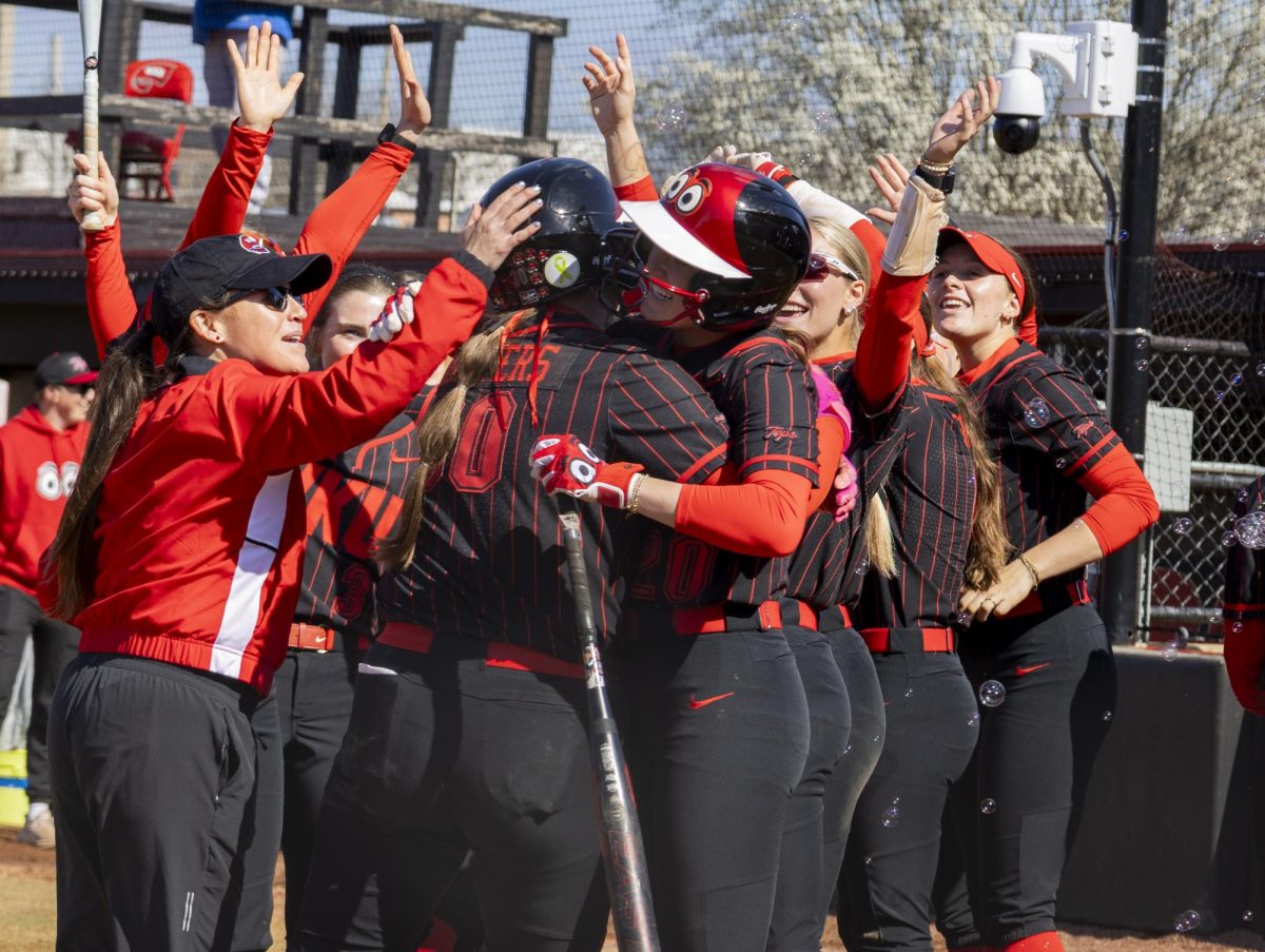 Western Kentucky University Hilltoppers celebrate after catcher Maci Masters (30) scored her ninth home run of the season during WKU’s game against Missouri State on Sunday, March 8, 2026. 